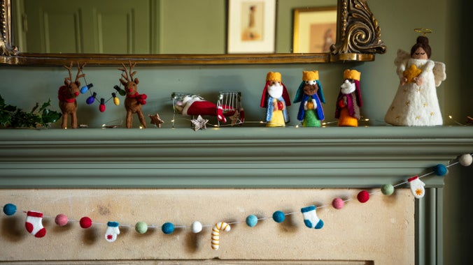 Christmas decorations, including garlands and felt characters, from the A/W 2025 collection